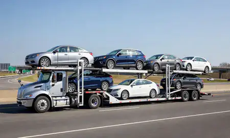 Multi-level car carrier on the highway to Somerville, Massachusetts, United States