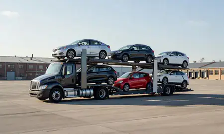 Car transporter loaded with vehicles in Somerville, Massachusetts, United States