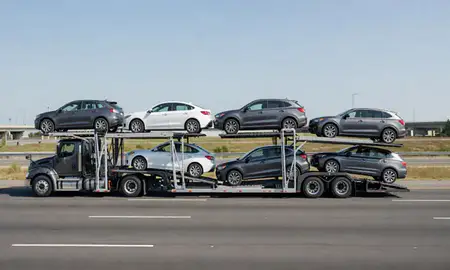 Multi-level car carrier on the highway to Springfield, Massachusetts, United States