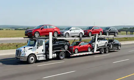 Multi-level car carrier on the highway to Taunton, Massachusetts, United States