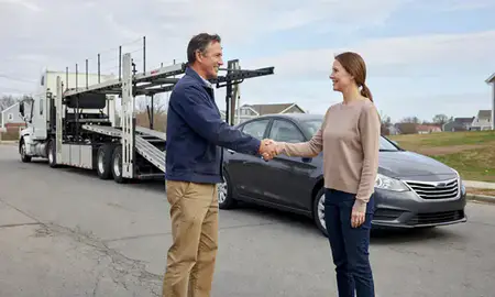 Vehicle owner beside their delivered car in Taunton, Massachusetts, United States