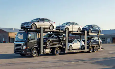Car transporter loaded with vehicles in Waltham, Massachusetts, United States