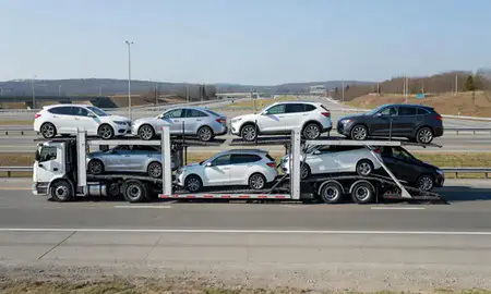 Multi-level car carrier on the highway to Worcester, Massachusetts, United States