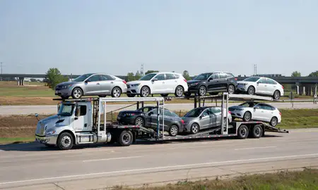 Multi-level car carrier on the highway to Battle Creek, Michigan, United States