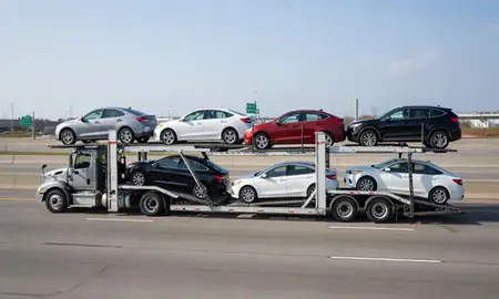 Multi-level car carrier on the highway to Dearborn, Michigan, United States