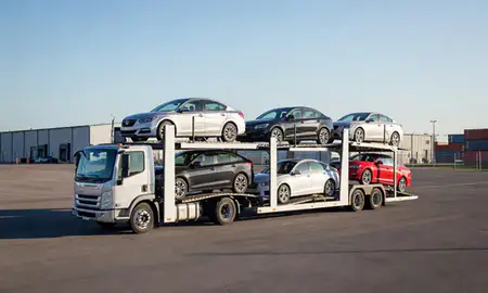 Car transporter loaded with vehicles in Holland, Michigan, United States