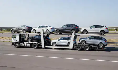 Multi-level car carrier on the highway to Jackson, Michigan, United States
