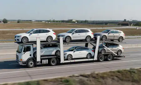 Multi-level car carrier on the highway to Kalamazoo, Michigan, United States