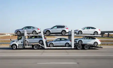 Multi-level car carrier on the highway to Livonia, Michigan, United States