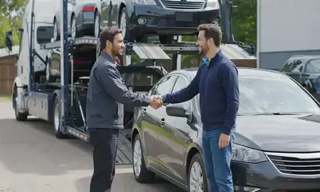 Vehicle owner beside their delivered car in Novi, Michigan, United States