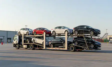 Car transporter loaded with vehicles in Royal Oak, Michigan, United States