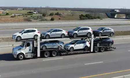 Multi-level car carrier on the highway to Troy, Michigan, United States