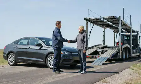 Vehicle owner beside their delivered car in Wyoming, Michigan, United States