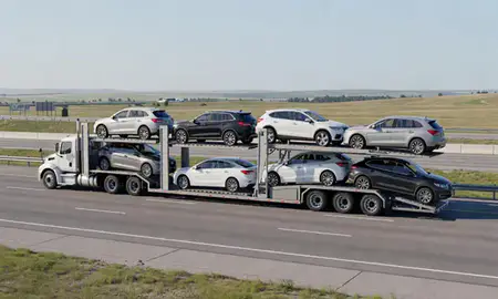 Multi-level car carrier on the highway to Minnesota, United States