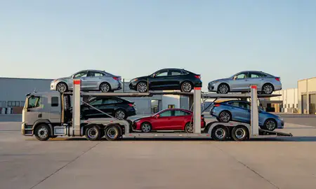 Car transporter parked in an industrial area of Minnesota, United States