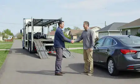 Vehicle owner beside their delivered car in Andover, Minnesota, United States