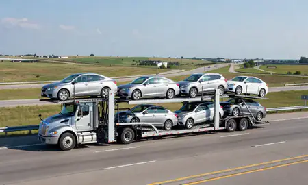 Multi-level car carrier on the highway to Apple Valley, Minnesota, United States