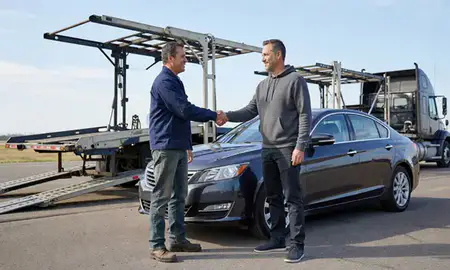 Vehicle owner beside their delivered car in Brooklyn Center, Minnesota, United States
