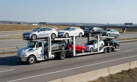 Multi-level car carrier on the highway to Burnsville, Minnesota, United States