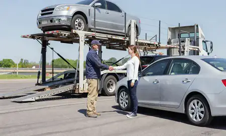Vehicle owner beside their delivered car in Burnsville, Minnesota, United States