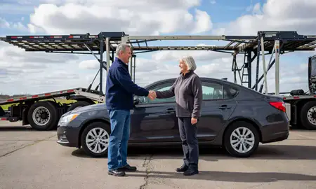 Vehicle owner beside their delivered car in Coon Rapids, Minnesota, United States
