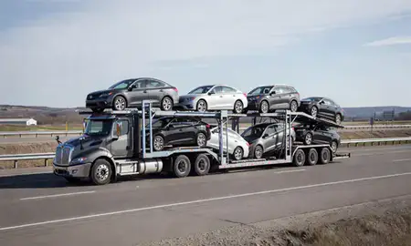 Multi-level car carrier on the highway to Duluth, Minnesota, United States