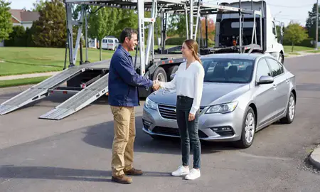 Vehicle owner beside their delivered car in Lakeville, Minnesota, United States