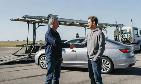 Vehicle owner beside their delivered car in Mankato, Minnesota, United States