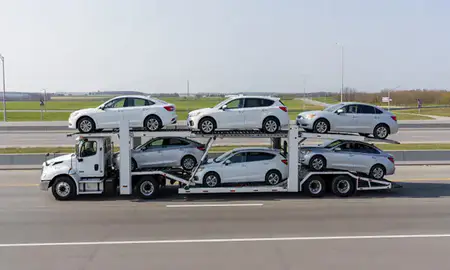 Multi-level car carrier on the highway to Maplewood, Minnesota, United States