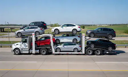 Multi-level car carrier on the highway to Minneapolis, Minnesota, United States