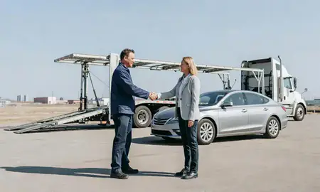 Vehicle owner beside their delivered car in Minneapolis, Minnesota, United States