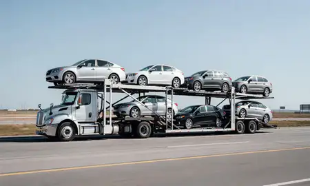 Multi-level car carrier on the highway to Moorhead, Minnesota, United States