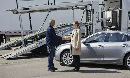 Vehicle owner beside their delivered car in Richfield, Minnesota, United States