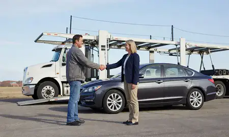 Vehicle owner beside their delivered car in Rochester, Minnesota, United States