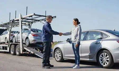 Vehicle owner beside their delivered car in Roseville, Minnesota, United States