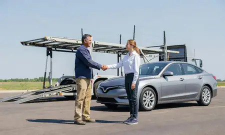 Vehicle owner beside their delivered car in Shakopee, Minnesota, United States