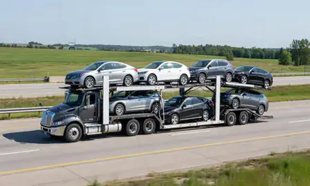 Multi-level car carrier on the highway to St. Cloud, Minnesota, United States