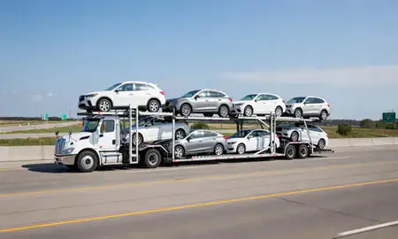 Multi-level car carrier on the highway to Woodbury, Minnesota, United States