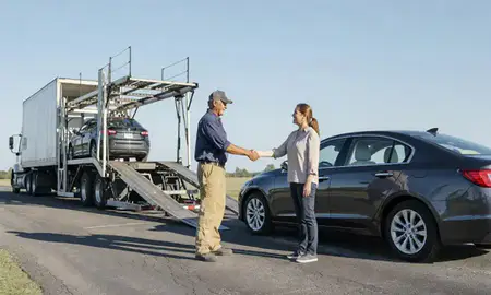 Vehicle owner beside their delivered car in Mississippi, United States