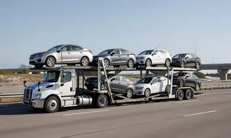 Multi-level car carrier on the highway to Biloxi, Mississippi, United States