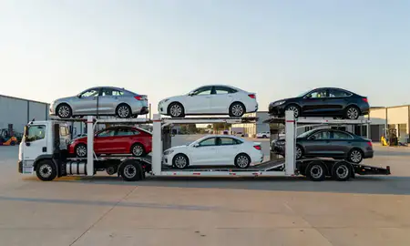 Car transporter parked in an industrial area of Columbus, Mississippi, United States