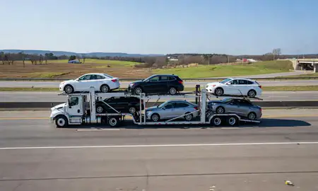 Multi-level car carrier on the highway to Corinth, Mississippi, United States