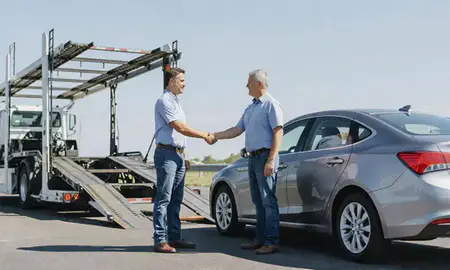 Vehicle owner beside their delivered car in Corinth, Mississippi, United States