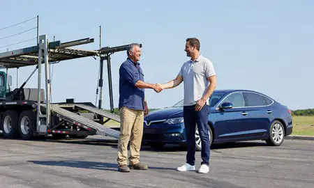 Vehicle owner beside their delivered car in D'Iberville, Mississippi, United States