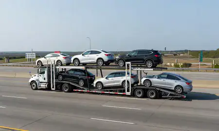 Multi-level car carrier on the highway to Gautier, Mississippi, United States
