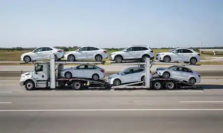 Multi-level car carrier on the highway to Greenville, Mississippi, United States