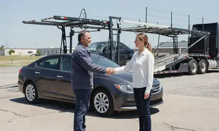 Vehicle owner beside their delivered car in Greenville, Mississippi, United States