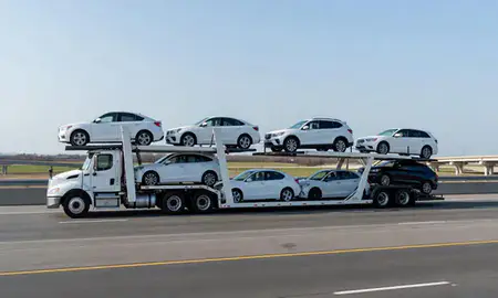 Multi-level car carrier on the highway to Greenwood, Mississippi, United States