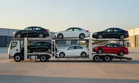 Car transporter parked in an industrial area of Greenwood, Mississippi, United States