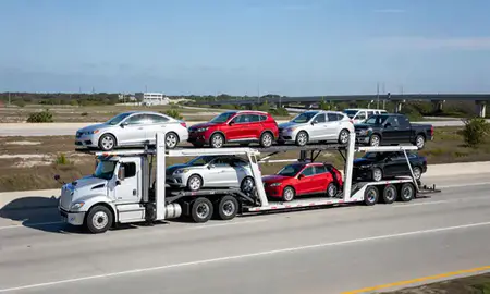 Multi-level car carrier on the highway to Gulfport, Mississippi, United States
